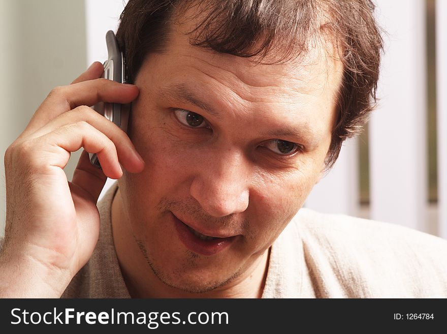 Serious businessman calling by phone. Serious businessman calling by phone