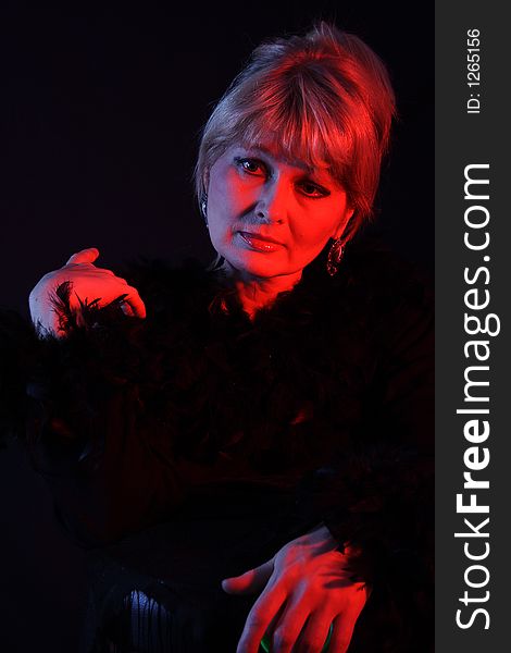 Theatrical portrait of a styled sorrow actress. Shot in studio. Theatrical portrait of a styled sorrow actress. Shot in studio.