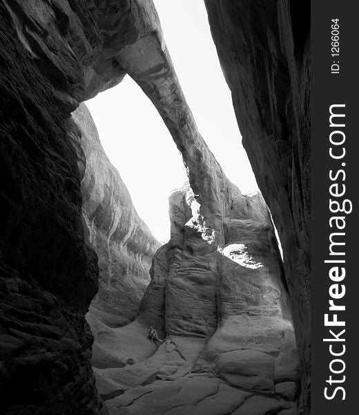 All alone at the beautiful and huge surprise arch in arches national park utah. All alone at the beautiful and huge surprise arch in arches national park utah