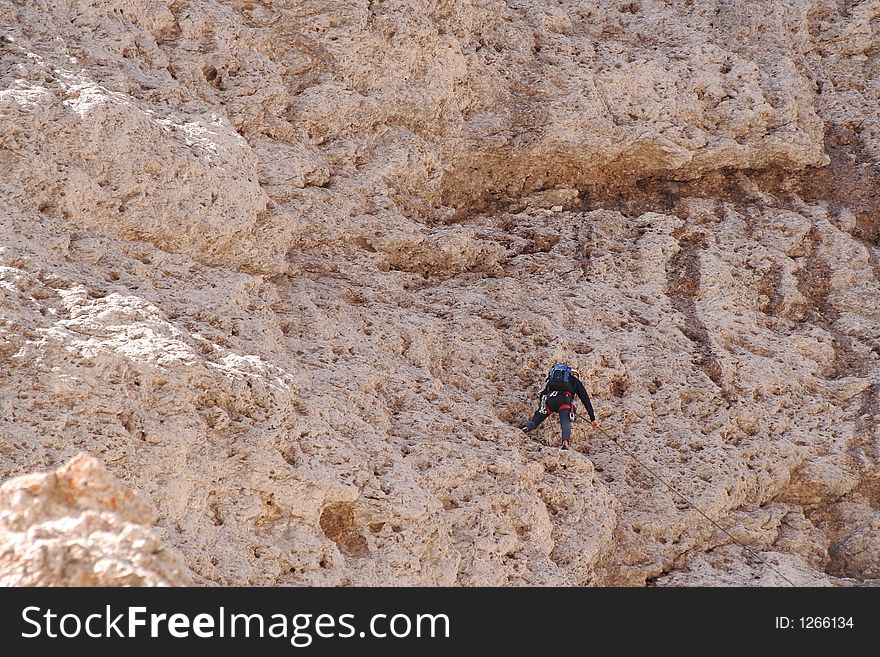 Rock climber on cliff,Dolomites,Italy