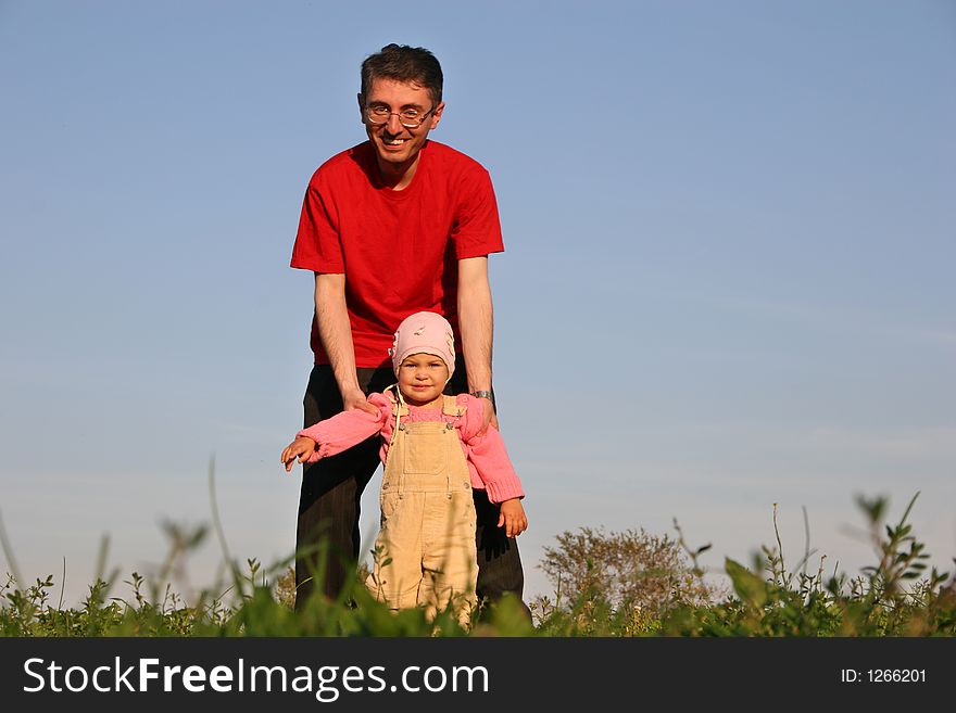 Father with baby on sky