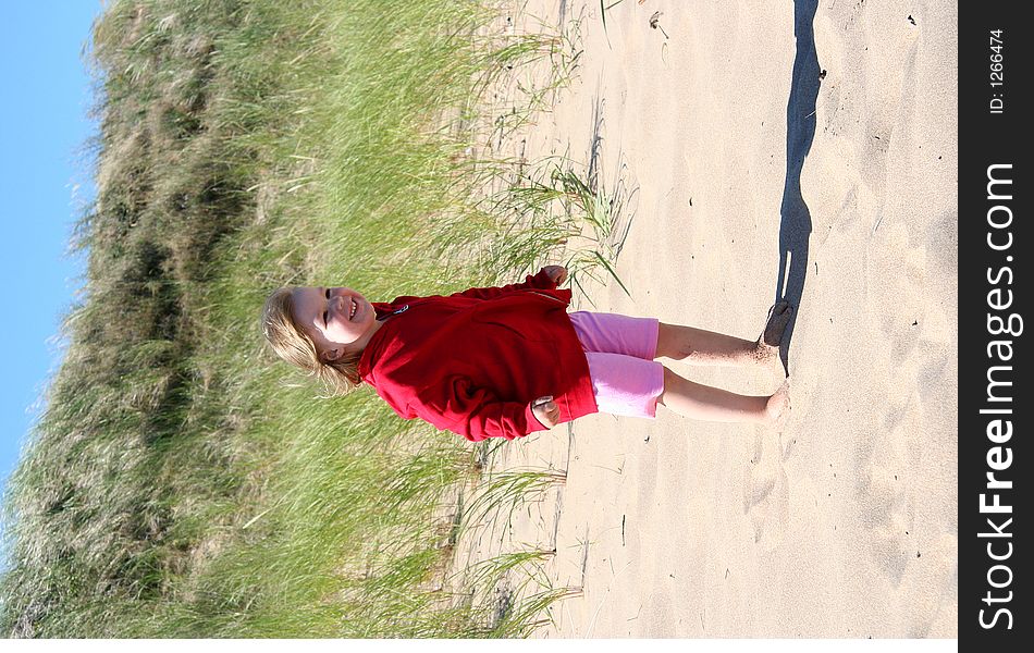 A smiling and happy child on the beach. A smiling and happy child on the beach