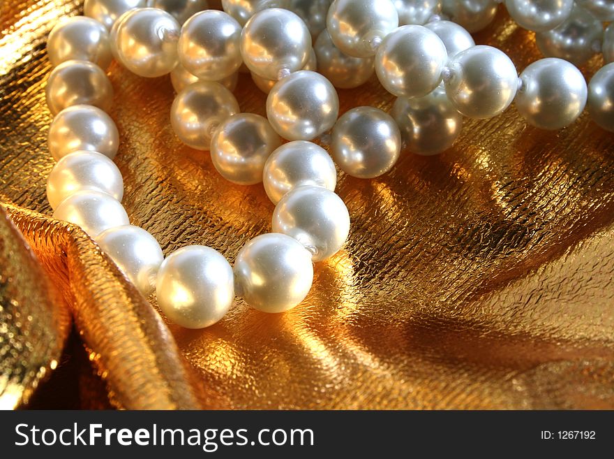 Pearls a necklace on a silk fabric