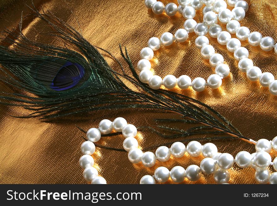 Pearls a necklace on a silk fabric