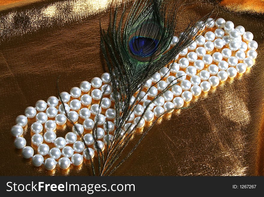 Pearls a necklace on a silk fabric