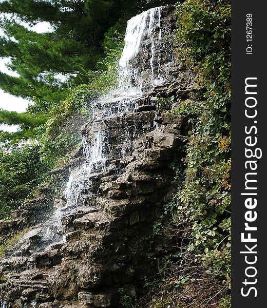 Waterfall, water cascading down slabs of rocks. Waterfall, water cascading down slabs of rocks