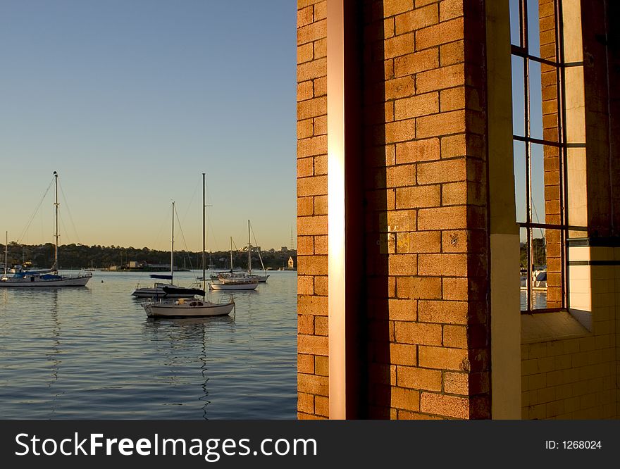 Warehouse wall and coastal  view with yachts. Warehouse wall and coastal  view with yachts