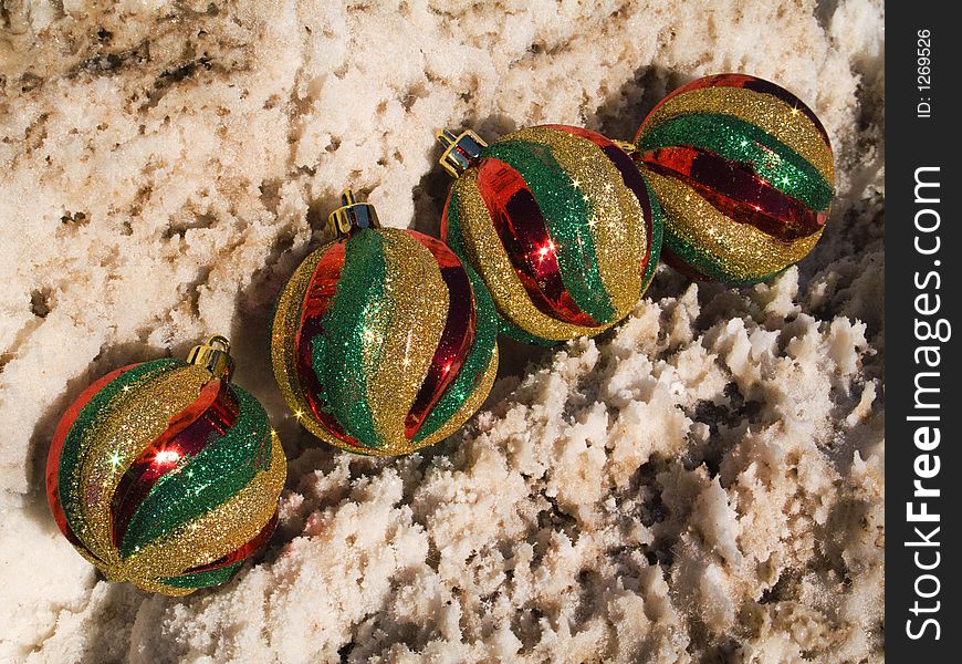 Four Christmas ornaments in a desert setting. Four Christmas ornaments in a desert setting