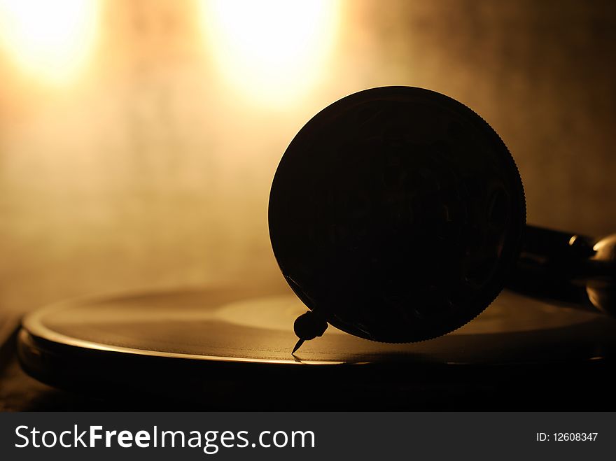 Old gramophone silhouette; warm sepia picture. Old gramophone silhouette; warm sepia picture