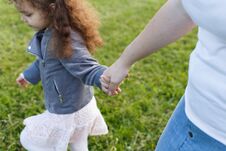 Mather And Baby Girl Holding Hand In Hand. Friendship In Family Royalty Free Stock Images