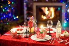 Beautiful Table Setting For Christmas Party Or New Year Celebration At Home. Cozy Room With A Fireplace And Christmas Tree In A Ba Stock Photography