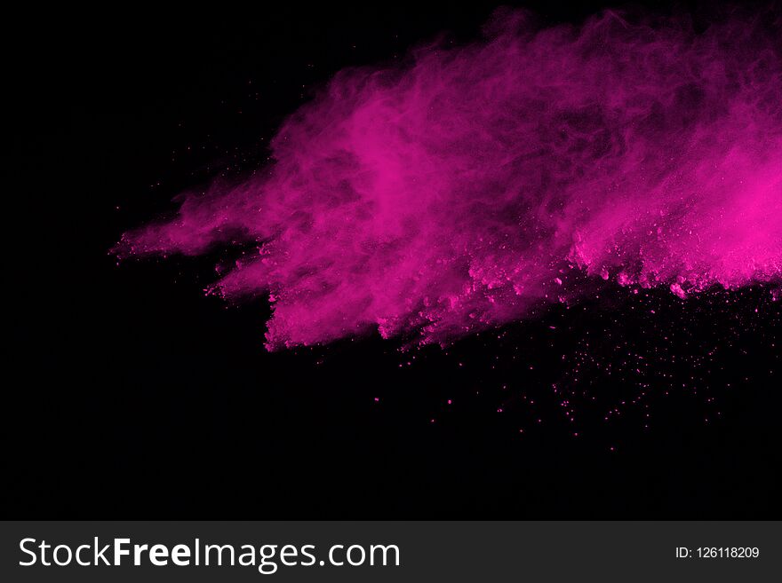 Abstract Pink Powder Explosion On Black Background. Abstract Colored Powder Splatted, Freeze Motion Of Pink Powder Exploding.