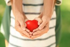 Adult And Child Hands Holding Heart Royalty Free Stock Photos