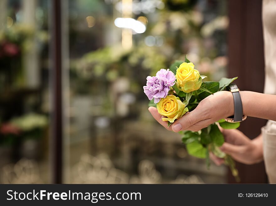 Female Florist Holding Beautiful Bouquet