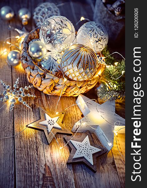 Christmas decoration for christmas tree New year greeting card at old vintage board with glass ball pattern garland and wooden stars. Christmas decoration for christmas tree New year greeting card at old vintage board with glass ball pattern garland and wooden stars.