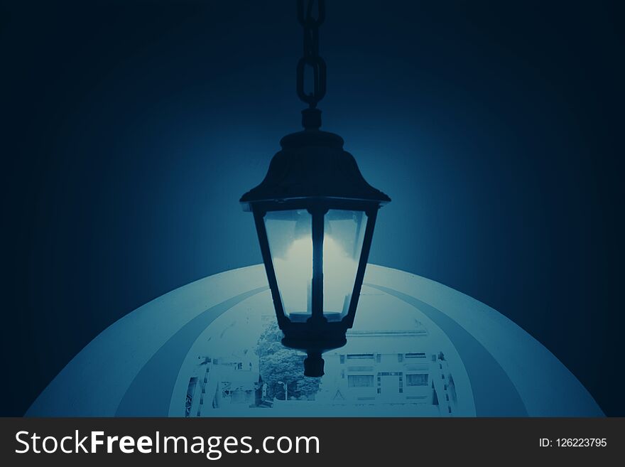 Dark blue background with vintage and patterned background. Routes and lanterns or bulbs