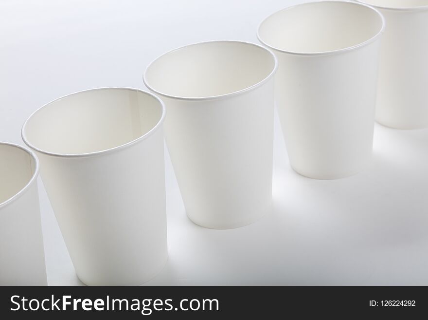 White paper coffee cup on white background. White paper coffee cup on white background.