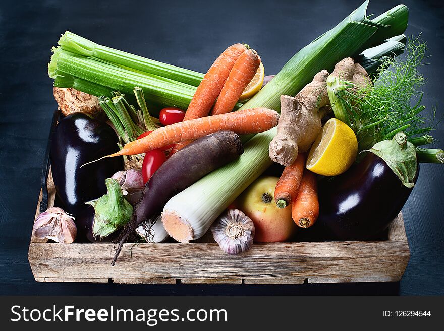 Local fresh raw vegetables in wooden box