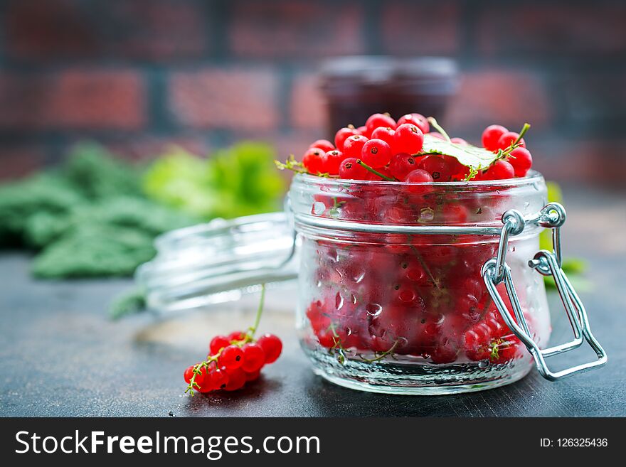 Red currant in glass on a table