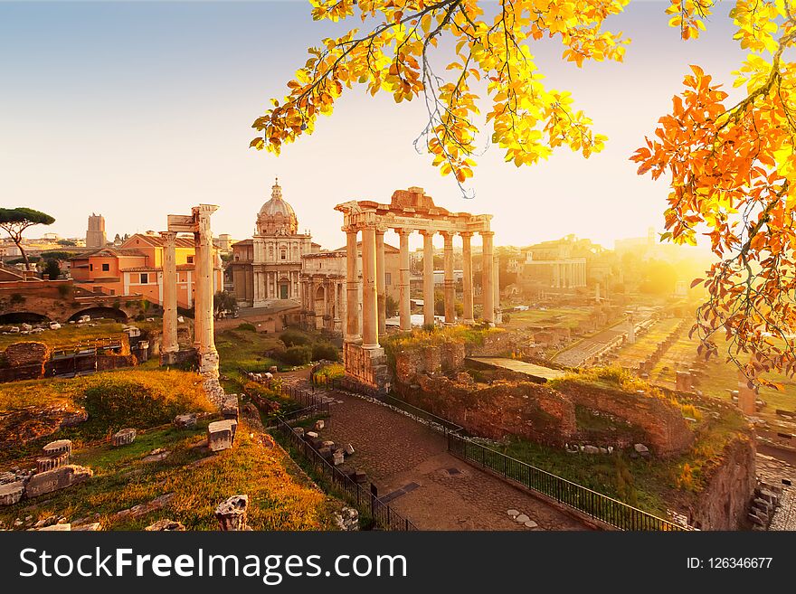 Forum - Roman ruins with cityscape of Rome with warm sunrire light, Italy af fall. Forum - Roman ruins with cityscape of Rome with warm sunrire light, Italy af fall