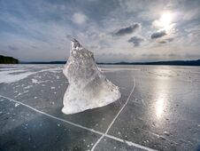Melting Of Pieces Of Thick Ice On Frozen Sea. Hot Sun Stock Photo