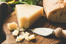 Parmesan Cheese And Cheese Knife On Wooden Board Royalty Free Stock Photography