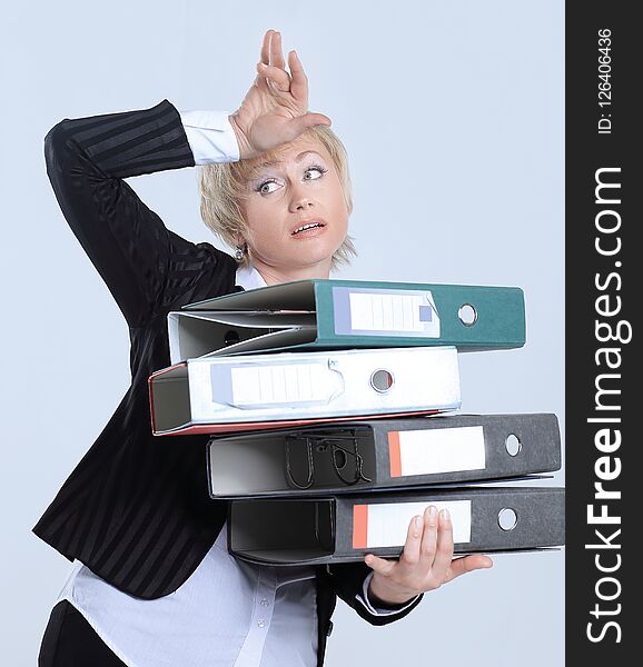 Astonished business woman with stack of documents. the concept of solving business problems