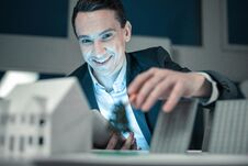 Smiling Young Man Successfully Finishing His Project Royalty Free Stock Images