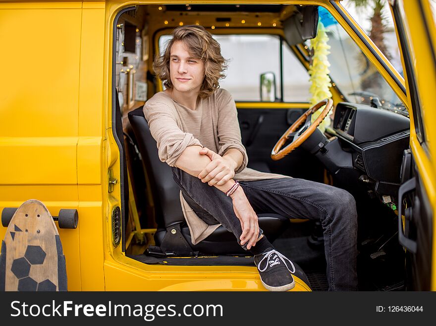 Guy Sitting Wheel Of Rented Car During His Anticipated Travel On Summer Vacations