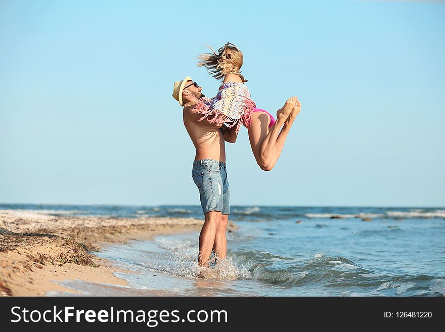 Young couple spending time together on beach