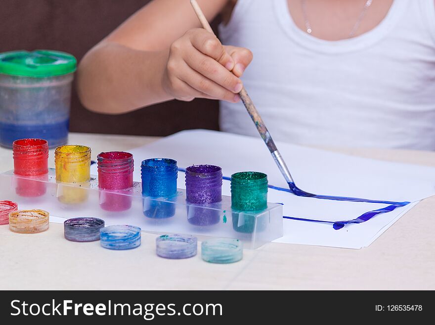 Hands Of Painting Boy Using Gouache On White Paper