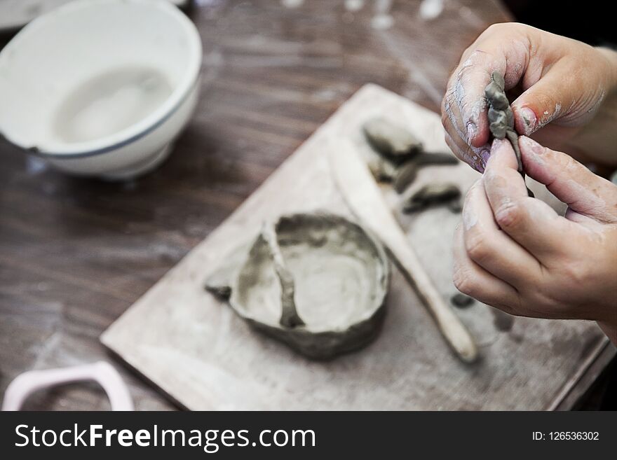 Close up of hands child making pottery. Close up of hands child making pottery