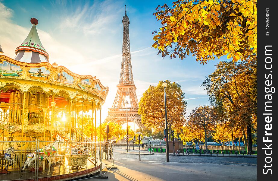 Eiffel Tower with merry go round from Trocadero at fall sunrise, Paris, France, toned. Eiffel Tower with merry go round from Trocadero at fall sunrise, Paris, France, toned