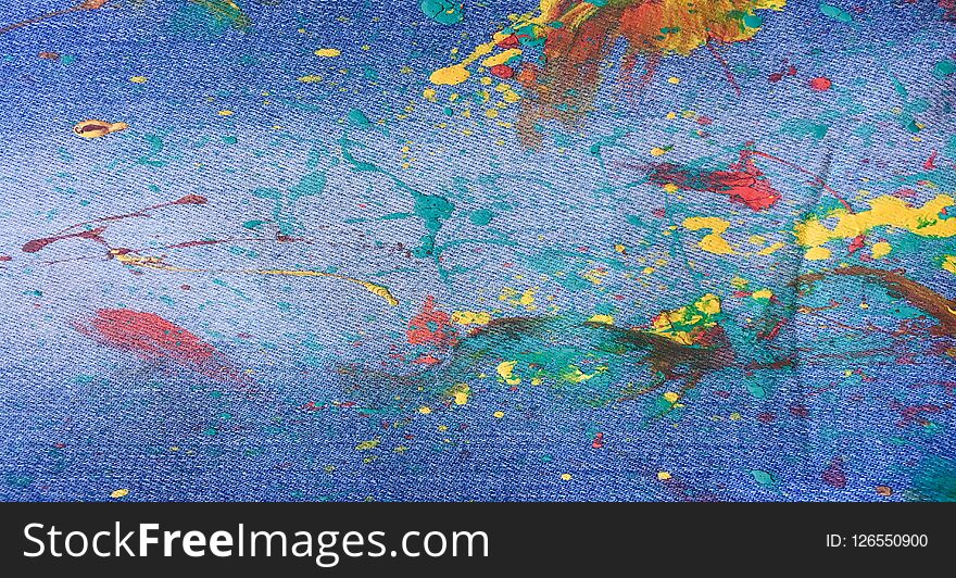 Denim, jeans texture background. Abstract oil paint texture on canvas. Drops of colorful paint on blue background denim, jeans.