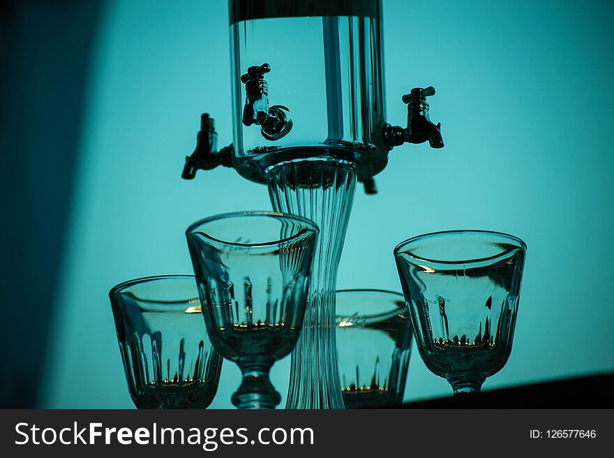 Ritual of glass of absinthe and dripping fountain