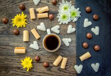 Coffee In A Cup, Sweets And Flowers On The Table Stock Photo