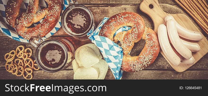 Oktoberfest Concept - Traditional Food And Beer On Rustic Background