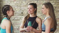 Group Of Fitness Women Chatting After Workout At The Gym Stock Photos