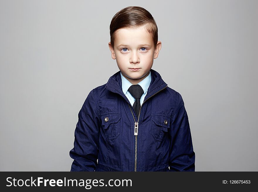 Elegant kid in tie, business child