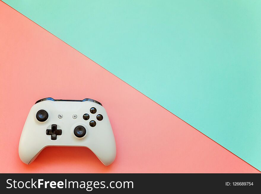 White joystick on pink and blue background