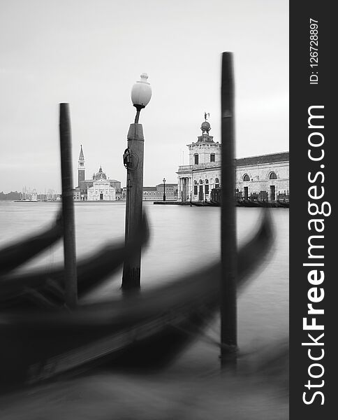 Harbor with gondolas in venice so close to sea