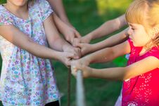 Group Of Happy Children Playing Tug Of War Outside On Grass. Kids Pulling Rope At Park Royalty Free Stock Photos