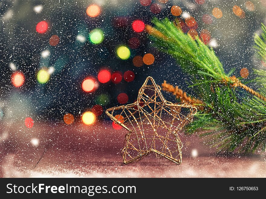 Christmas and New Year`s concept. Gifts, lanterns, bell, bokeh on a wooden background