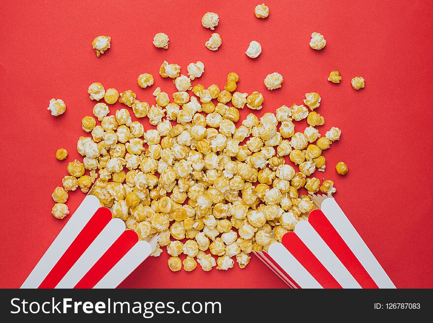 Popcorn On A Red Background Top View In Cinema