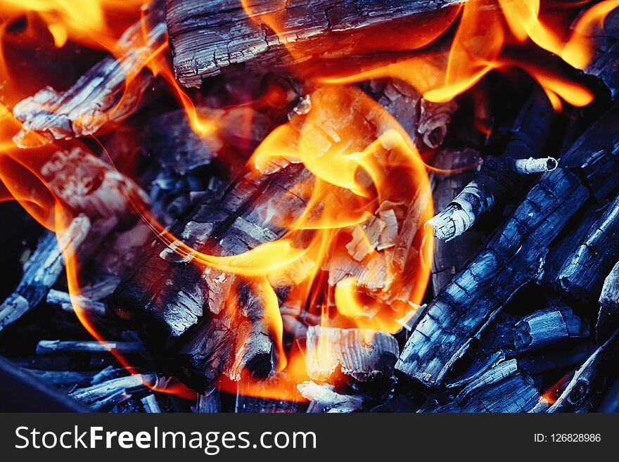 Burning wood in a brazier. Fire, flames. Grill or bbq