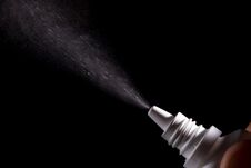 Spray For Nose Sprayed In The Air On A Black Background Stock Photography