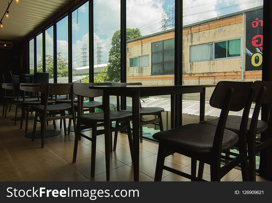 Empty chair in the cafe. Silhouette. At shop.