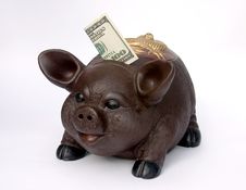 Piggy Bank With U.S. One Hundred Dollars In Slot Royalty Free Stock Images