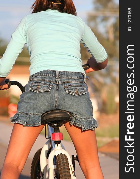 Back of girl on bike. Back of girl on bike