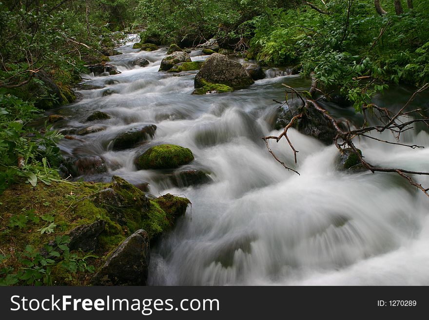 Rough mountain stream in northern mountains of the Europe